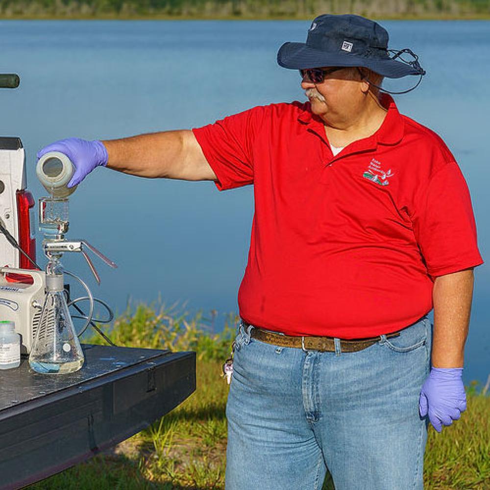 Image of environmental compliance specialist conducting test.