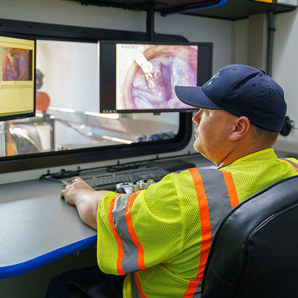 Image of CCTV crew in viewing booth. 