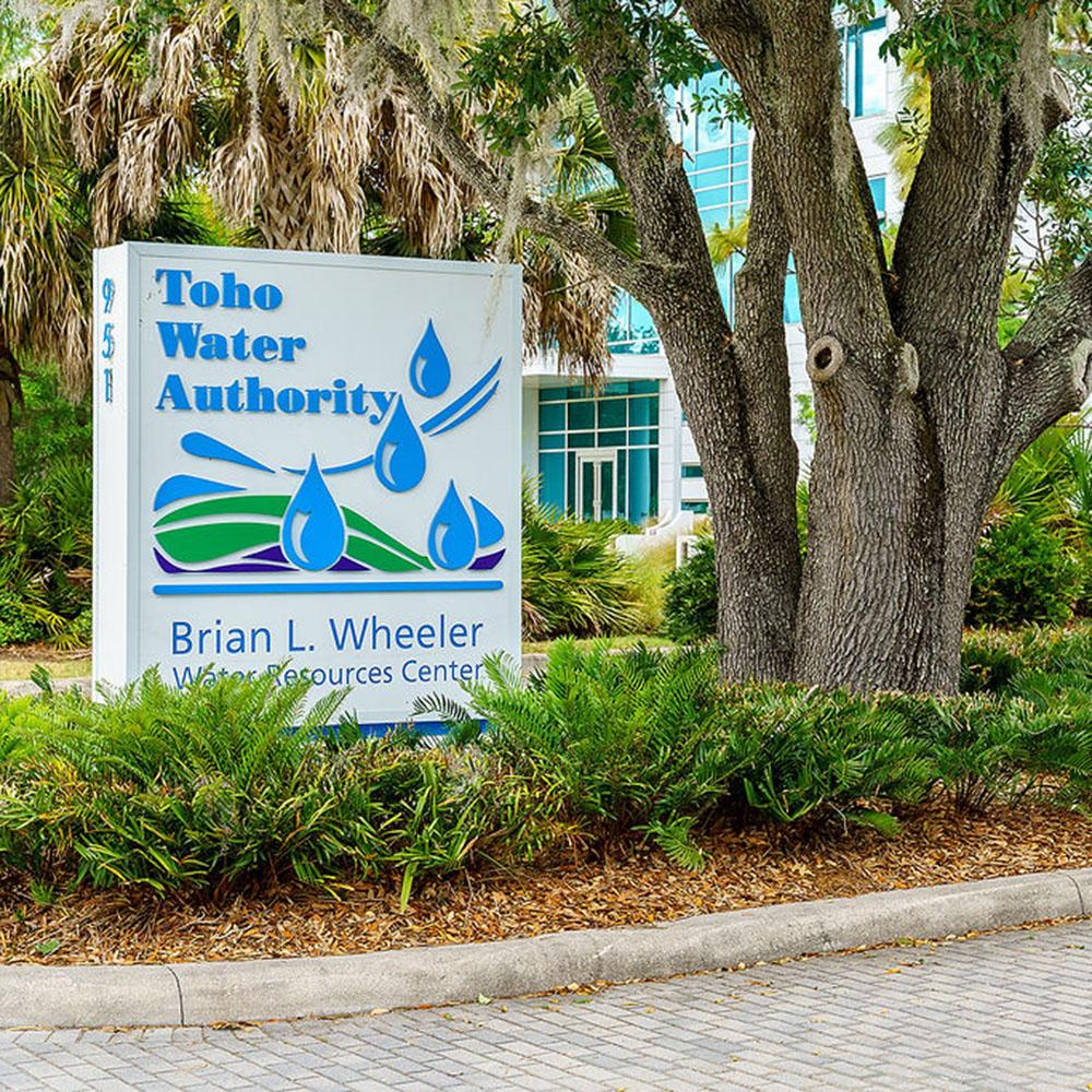 Image of Toho Water Authority sign at the entrance of the administration building.