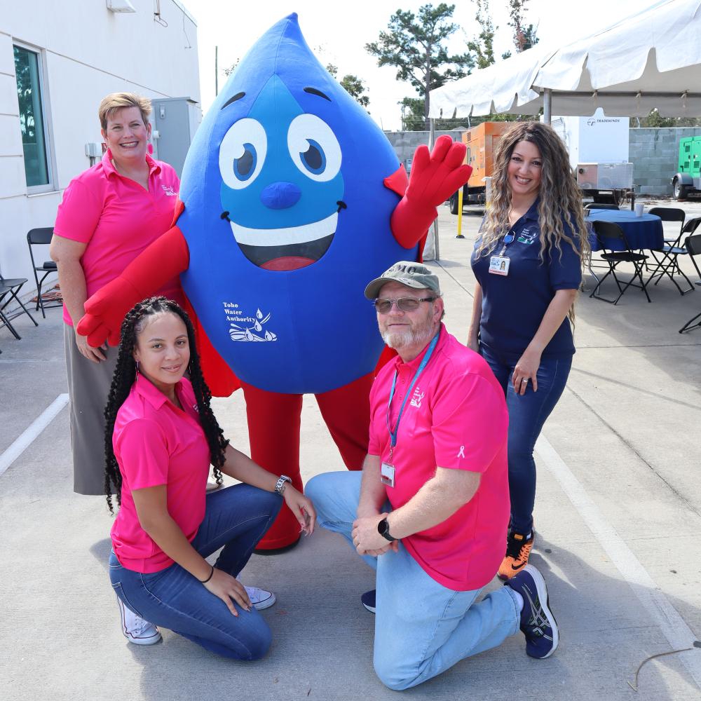 Hydro, the mascot, at an event with employees.