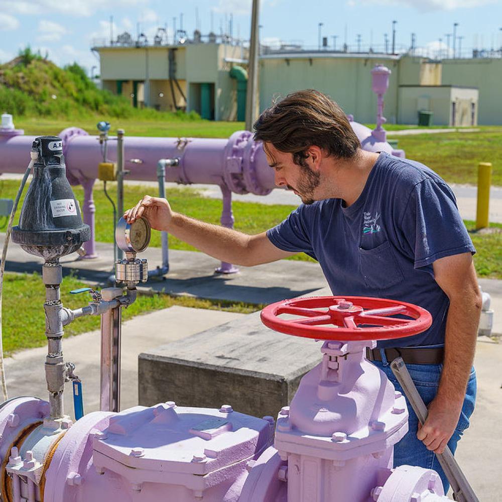 Image of operator checking equipment at reclaimed water facility.