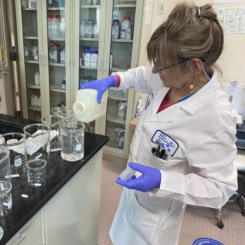 Image of lab technician conducting a test.