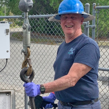 Systems Mechanic Bill Fry working on a pump at a sewer lift station.